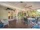 Screened porch featuring comfortable seating, and views of the landscaped yard at 3619 Loggerhead Ct, Seabrook Island, SC 29455