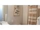 Bathroom featuring a shower with a striped curtain, a vanity with a mirror, and fresh towels at 40 Bee St # 112, Charleston, SC 29403