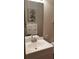 Well-lit bathroom featuring a modern sink, large mirror, and white towels at 40 Bee St # 112, Charleston, SC 29403