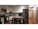 Modern kitchen featuring stainless steel appliances, granite countertops and dark wood table at 40 Bee St # 112, Charleston, SC 29403