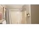Clean bathroom featuring a shower with neutral curtain and minimalist decor at 40 Bee St # 309, Charleston, SC 29403