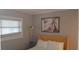 Cozy bedroom with a bright yellow headboard, natural light, and simple decor at 40 Bee St # 309, Charleston, SC 29403