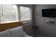 Bedroom featuring a comfortable bed, natural light and a wall-mounted television at 40 Bee St # 309, Charleston, SC 29403