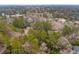 Aerial view of wooded property with homes, and winding driveways at 415 W Carolina Ave, Summerville, SC 29483