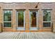 Wooden deck and exterior elevation view of log cabin home at 415 W Carolina Ave, Summerville, SC 29483