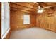 Bedroom with wood-paneled walls, ceiling fan, and a cozy atmosphere at 415 W Carolina Ave, Summerville, SC 29483