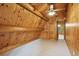 Bedroom with a window, carpeted floor and angled plank walls and a beam ceiling at 415 W Carolina Ave, Summerville, SC 29483