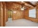 Spacious bedroom with wood-paneled walls and ceiling fan at 415 W Carolina Ave, Summerville, SC 29483