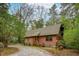 Charming log cabin featuring a gable roof and inviting front porch at 415 W Carolina Ave, Summerville, SC 29483