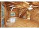 Spacious living room features hardwood floors, wood paneling, and a staircase at 415 W Carolina Ave, Summerville, SC 29483
