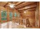 Open-concept living area with a wood-beamed ceiling and natural light at 415 W Carolina Ave, Summerville, SC 29483