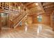 Expansive living area with hardwood floors and wood-paneled walls, bathed in natural light at 415 W Carolina Ave, Summerville, SC 29483