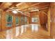 Bright, open-concept living room featuring gleaming hardwood floors and a soaring ceiling at 415 W Carolina Ave, Summerville, SC 29483