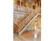 Detailed wood staircase featuring plank walls and wood floors; leading to the upper level of the home at 415 W Carolina Ave, Summerville, SC 29483