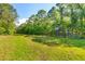 Heavily wooded property with hunting stand, providing ultimate privacy at 4304 River Rd, Johns Island, SC 29455