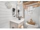 Stylish bathroom with shiplap walls, decorative mirror, vanity with storage, and toilet with a bidet at 4530 Holly St, North Charleston, SC 29405