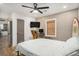Inviting bedroom, featuring a computer desk, ceiling fan, and ensuite bath at 4530 Holly St, North Charleston, SC 29405