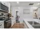 Well-equipped kitchen, with seamless view to bathroom and bedroom at 4530 Holly St, North Charleston, SC 29405