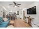 Open-concept living area with hardwood floors and modern decor, showcasing seamless flow to the kitchen at 4530 Holly St, North Charleston, SC 29405