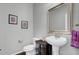 Charming powder room featuring a pedestal sink, decorative accents, and a modern mirror at 494 Sanders Farm Ln, Charleston, SC 29492