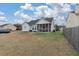 Backyard featuring a screened in porch and large yard at 5051 Ballantine Dr, Summerville, SC 29485