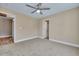 Spacious carpeted bedroom with ceiling fan and neutral walls, offering a serene and comfortable living space at 515 Travelers Blvd, Summerville, SC 29485