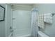 Bright bathroom featuring a shower and tub combination and coordinating towel racks at 616 W 2Nd N St, Summerville, SC 29483