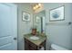 Elegant bathroom with granite countertop vanity and decorative accents at 616 W 2Nd N St, Summerville, SC 29483