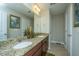 Well-lit bathroom featuring double granite vanity and tile flooring at 616 W 2Nd N St, Summerville, SC 29483