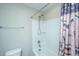 Bright bathroom with shower and tub combination and patterned curtain at 616 W 2Nd N St, Summerville, SC 29483