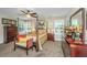 Comfortable bedroom with a ceiling fan, a four-poster bed, and natural light at 616 W 2Nd N St, Summerville, SC 29483