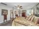Relaxing bedroom showcasing a four-poster bed, ceiling fan, and natural light at 616 W 2Nd N St, Summerville, SC 29483