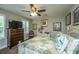 Bedroom with ceiling fan and cottage-style furniture, including a white wicker dresser at 616 W 2Nd N St, Summerville, SC 29483