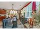 Nicely decorated dining room with wood floors, shuttered windows, buffet, chandelier, and attractive decor at 616 W 2Nd N St, Summerville, SC 29483