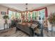 Elegant dining area featuring wood floors, chandelier, bench seating, decorative window treatments, and stylish decor at 616 W 2Nd N St, Summerville, SC 29483