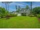 Charming two-story home featuring an attached garage, and lush landscaping at 616 W 2Nd N St, Summerville, SC 29483