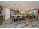 Open-concept kitchen featuring a large island, stainless steel appliances, and hardwood floors at 616 W 2Nd N St, Summerville, SC 29483