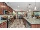 Kitchen with granite countertops, stainless appliances, spacious island, and pendant lighting at 616 W 2Nd N St, Summerville, SC 29483