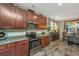 Updated kitchen with granite countertops, stainless steel appliances and dark wood cabinets at 616 W 2Nd N St, Summerville, SC 29483