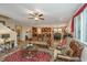 Bright living room with hardwood floors, decorative rug, open floor plan, and abundant natural light at 616 W 2Nd N St, Summerville, SC 29483