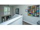 Bright staircase with white railings and colorful decorations at 616 W 2Nd N St, Summerville, SC 29483
