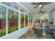 Inviting sunroom with lots of windows and natural light, ceiling fans, and slate floors at 616 W 2Nd N St, Summerville, SC 29483