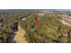 Aerial view of a home surrounded by dense greenery, near golf course and marshes at 625 Double Eagle Trce, Seabrook Island, SC 29455