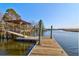 Community dock with boat lift for residents, offering waterfront fun and serene marsh views at 6902 Tanner Hall Blvd, Hanahan, SC 29410