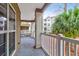 Spacious balcony with white railing, overlooking trees and other residential buildings at 700 Daniel Ellis Dr # 8107, Charleston, SC 29412