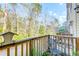 View from the balcony of a wooded area and nearby homes at 949 E Estates Blvd # 303, Charleston, SC 29414