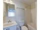 Clean bathroom with a white vanity, toilet, and shower-tub combination at 949 E Estates Blvd # 303, Charleston, SC 29414