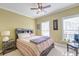 Bedroom with a bed, nightstand, and windows allowing for lots of natural light at 949 E Estates Blvd # 303, Charleston, SC 29414