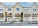 Three-story townhouses with individual balconies and garages in a well-maintained community at 949 E Estates Blvd # 303, Charleston, SC 29414