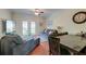 Comfortable living room featuring a ceiling fan, sofas, and a sliding glass door to the outside at 949 E Estates Blvd # 303, Charleston, SC 29414